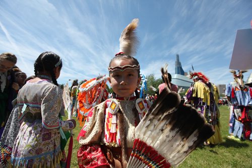 Six-year-old Serene Oakes dances on the fields at the Forks National Historic site for Aboriginal Day Pow Wow Saturday afternoon during the Grand Entry. Standup photo.  June 21, 2014 Ruth Bonneville / Winnipeg Free Press