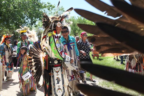 Aboriginal Dancers wait in line to dance in the Grand Entry  during Pow Wow on the  fields at the Forks National Historic site for Aboriginal Day Saturday afternoon. Standup photo.  June 21, 2014 Ruth Bonneville / Winnipeg Free Press