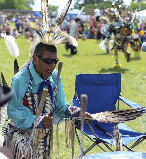 Chuck Spence sings and plays the drums while dancers perform at the Aboriginal Day celebration at The Forks. Sarah Taylor / Winnipeg Free Press