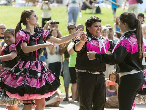 Tracie Leost, Michael Harris and other members of Ivan Flett Memorial Dancers perform at the Aboriginal Day celebration on Saturday. Sarah Taylor / Winnipeg Free Press