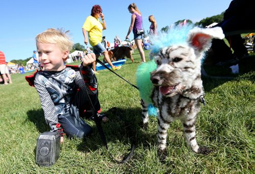 Ethan Stairs, 5, dressed as Thor, and Petie a Bichon Maltese at the Paws in Motion event in Assiniboine Park, Sunday, June 22, 2014. (TREVOR HAGAN/WINNIPEG FREE PRESS)