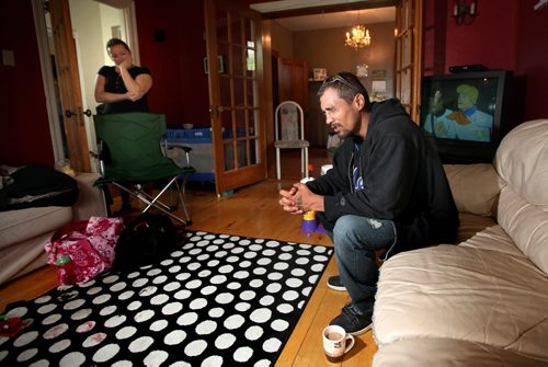 Fighting back tears, Robert Scherban describes how his 3 yr old son was killed in a lane between Victor and Young Streets Sunday afternoon. His sister Robin Appasani listens. See story.  June 23, 2014 - (Phil Hossack / Winnipeg Free Press)