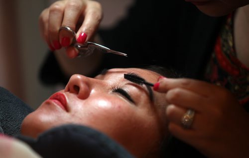 Connie Tamoto undergoes eyebrow transformation. RE: Eyebrow filling in - new beauty service similar to lash extensions. See Connie's story.  June 23, 2014 - (Phil Hossack / Winnipeg Free Press)