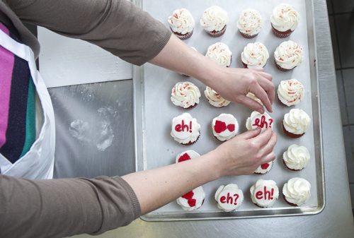 140623 Winnipeg - DAVID LIPNOWSKI / WINNIPEG FREE PRESS (June 23, 2014)  Cake decorator Jess Young King prepares Canada Day Cupcakes at Cake-ology (with the help of owner Pam Kirkpatrick Monday June 23.
