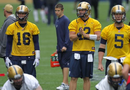 WINNIPEG BLUE BOMBER PRACTICE - QBs #16 Robert Marve, #12 Brian Brohm, and #5 Drew Willy during some drills in practice. BORIS MINKEVICH / WINNIPEG FREE PRESS  June 24, 2014