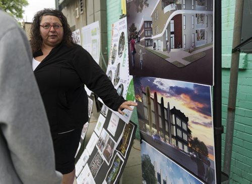 Board member of North End Community Renewal Corporation Haven Stumpf talks about the designs for the new Merchant Hotel. Sarah Taylor / Winnipeg Free Press