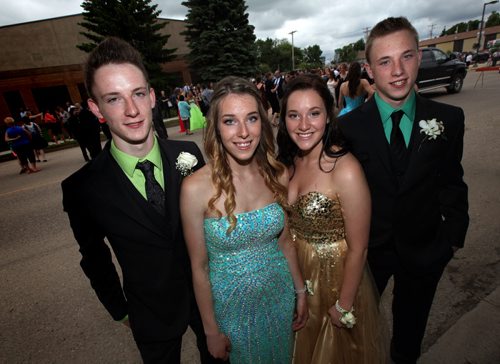 Left to right, Greg, Maryn, Janelle, and Myles Lavich the Carberry quads were part of the  graduation photo on Carberry's main street. See Randy Turner's tale. June 25, 2015 - (Phil Hossack / Winnipeg Free Press)