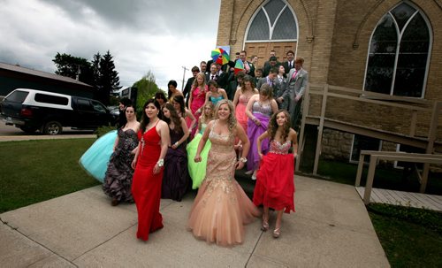 Carberry's class of 14 comes down from Church Steps used as risers for the class picture Wednesday. THe Carberry Lavich quads were part of the  graduation photo on Carberry's main street. See Randy Turner's tale. June 25, 2015 - (Phil Hossack / Winnipeg Free Press)