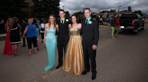 Left to right, Maryn, Greg, Janelle, and Myles Lavich the Carberry quads were part of the  graduation photo on Carberry's main street. See Randy Turner's tale. June 25, 2015 - (Phil Hossack / Winnipeg Free Press)