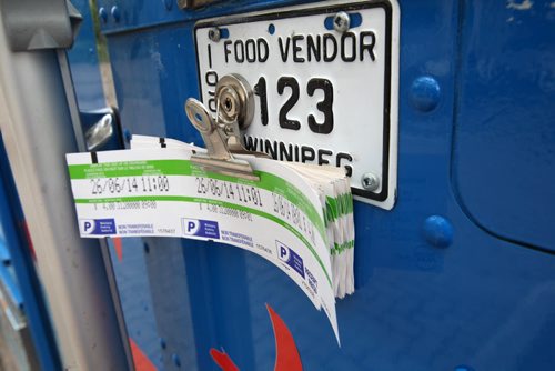 Owner Roddy Seradilla -Pimp My Rice food truck on Broadway-Parking meter receipts - See Alison Gillmor story- June 26, 2014   (JOE BRYKSA / WINNIPEG FREE PRESS)