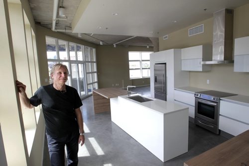 Nestor Budyk owns the building at 448 Hargrave St., he is in one of the condos. He has spent years and tens of thousands of dollars converting it into an office/condo complex. Murray McNeill story Wayne Glowacki / Winnipeg Free Press June 26 2014