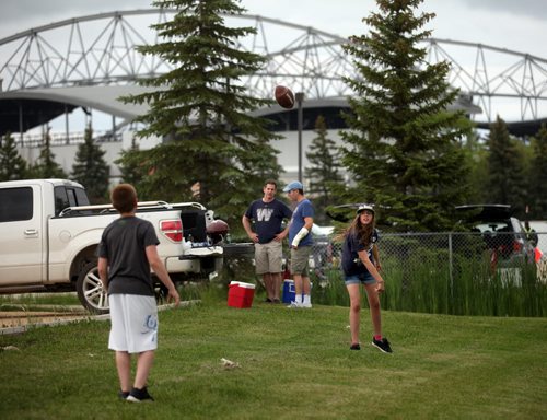 Tailgaters in the parking lot before the Bomber's Home Opener Thursday evening. See Nick Martin's tale. June 26, 2014 - (Phil Hossack / Winnipeg Free Press)