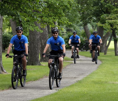 STDUP .The Wpg Police Service will have a 16 person Cadet Bike  Patrol that will be  patrolling  city wide this summer , they will  patrol parks , bike paths and riverbanks  in addition  to city streets  and neighborhoods .Unit was introduces at ST. John's Park newser. June 27 2014 / KEN GIGLIOTTI / WINNIPEG FREE PRESS
