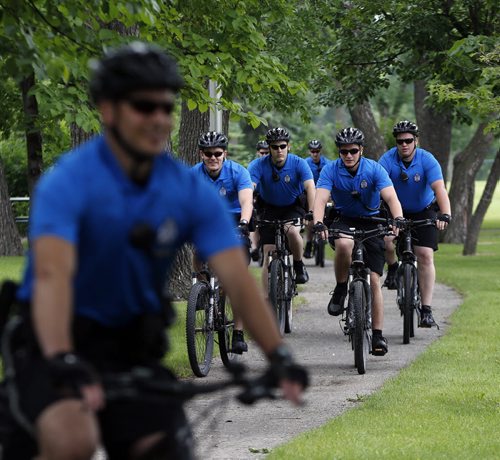 STDUP . The Wpg Police Service will have a 16 person Cadet Bike  Patrol that will be  patrolling  city wide this summer , they will  patrol parks , bike paths and riverbanks  in addition  to city streets  and neighborhoods .Unit was introduces at ST. John's Park newser. June 27 2014 / KEN GIGLIOTTI / WINNIPEG FREE PRESS