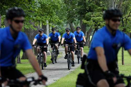 Stdup . The Wpg Police Service will have a 16 person Cadet Bike  Patrol that will be  patrolling  city wide this summer , they will  patrol parks , bike paths and riverbanks  in addition  to city streets  and neighborhoods .Unit was introduces at ST. John's Park newser. June 27 2014 / KEN GIGLIOTTI / WINNIPEG FREE PRESS