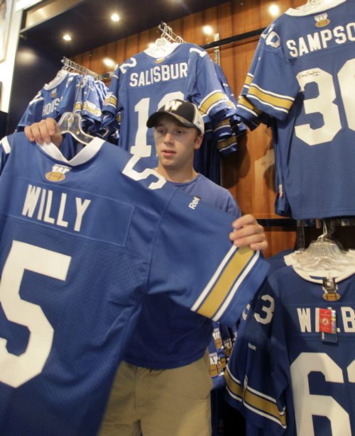 Winnipeg Blue Bomber QB Drew Willy #5 jerseys are the big seller at the Bomber Store at Investors Group Field Friday the day after the season opener victory over Toronto. Justin Fitkowski was at Thursday night's game bought a #5 jersey Friday.   Paul Wicek story Wayne Glowacki / Winnipeg Free Press June 27 2014
