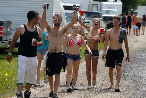 DAUPHIN'S COUNTRYFEST - Friday afternoon party in the campground. Some people soak up the hot sun. BORIS MINKEVICH / WINNIPEG FREE PRESS  June 27, 2014