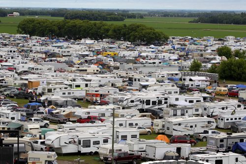 DAUPHIN'S COUNTRYFEST - Campers fill the fields behind the stage. The festival expanded it's camping area to 4300 this year. BORIS MINKEVICH / WINNIPEG FREE PRESS  June 27, 2014