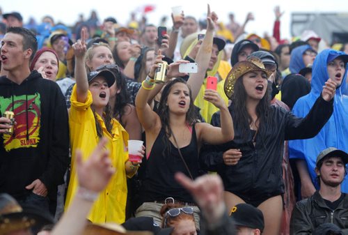 DAUPHIN'S COUNTRYFEST - Fans rock on through the rain during Lee Brice Friday evening. BORIS MINKEVICH / WINNIPEG FREE PRESS  June 27, 2014