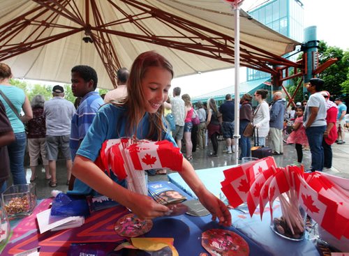 Nine year old Xavier Ouellette does some painting at one of the kids kiosks at the Forks during Multiculturalism Day Saturday afternoon. The free event is a interactive, family event featuring performers, entertainers, artisans and displays, all in celebration of Manitobas cultural diversity. Families will have the opportunity to engage with a multitude of cultures through music, dance and storytelling throughout the day Standup photo  June 28, 2014 Ruth Bonneville / Winnipeg Free Press