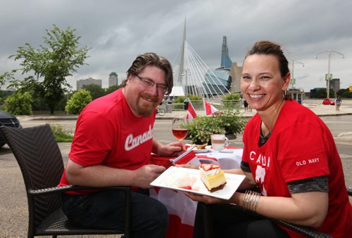 Shawn and Connie Brandson, owners of Promenade Cafe and Wine Restaurant on Provencher plan on closing off their parking lot on Canada Day and turning it into a giant patio.  Their customers will enjoy overlooking one of the most beautiful cityscapes in Winnipeg, downtown Winnipeg wight he Canadian Museum for Human RIghts as a backdrop.   See Story.    June 28, 2014 Ruth Bonneville / Winnipeg Free Press