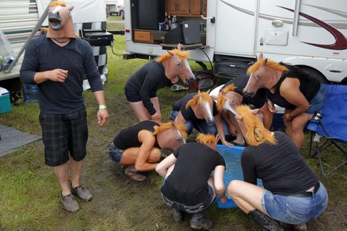 DAUPHIN'S COUNTRYFEST - SATURDAY -Some festival goers horsing around. BORIS MINKEVICH / WINNIPEG FREE PRESS  June 27, 2014