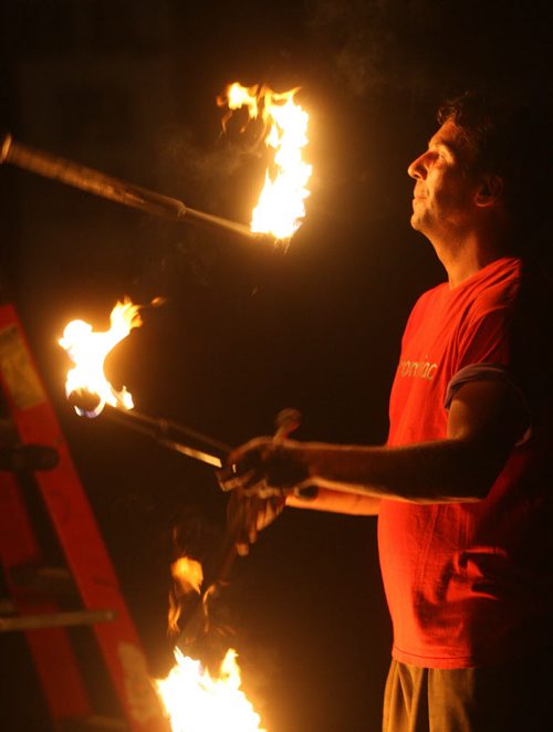 DAUPHIN'S COUNTRYFEST - FRIDAY -Festival sideshow entertainer juggles fire late at night. BORIS MINKEVICH / WINNIPEG FREE PRESS  June 27, 2014