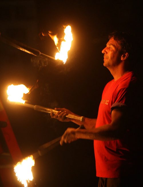 DAUPHIN'S COUNTRYFEST - FRIDAY -Festival sideshow entertainer juggles fire late at night. BORIS MINKEVICH / WINNIPEG FREE PRESS  June 27, 2014