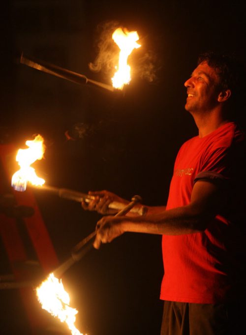 DAUPHIN'S COUNTRYFEST - FRIDAY -Festival sideshow entertainer juggles fire late at night. BORIS MINKEVICH / WINNIPEG FREE PRESS  June 27, 2014