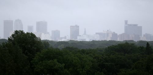 Rain Showers make the downtown skyline hard to see, from Garbage Hill, Sunday, June 29, 2014. (TREVOR HAGAN/WINNIPEG FREE PRESS)