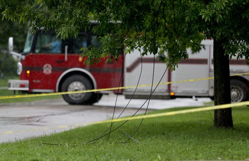 Downed power lines at the corner of Church Avenue and Parr Street, Sunday, June 29, 2014. (TREVOR HAGAN/WINNIPEG FREE PRESS)