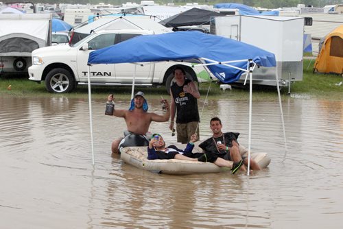 DAUPHIN'S COUNTRYFEST - SUNDAY -Some good ol boys float in the campground on the final day of the festival. Rain blessed festival goers most of the weekend. BORIS MINKEVICH / WINNIPEG FREE PRESS  June 29, 2014