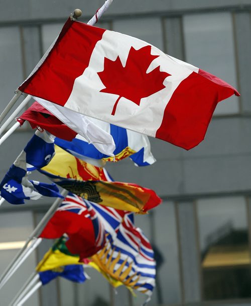 STDUP .New Canadian Flags are flying around the  city in preparation for Canada Day on Tuesday , this one flies with all the provincial flags outside the Fairmont Hotel .June 30 2014 / KEN GIGLIOTTI / WINNIPEG FREE PRESS
