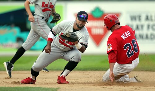 Fargo-Moorhead 2nd baseman Brandon Newton snags the catch too late to tag Winnipeg Goldeye #26 Donnie Webb Monday afternoon in the 5th inning of the first game of a double header at Shaw Park. June 30, 2014 - (Phil Hossack / Winnipeg Free Press)