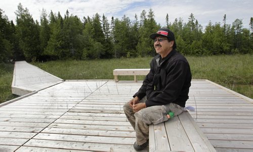 Carl Smith with the Brokenhead Ojibway Nation on the  tour of  the Brokenhead Wetland, at the corner of Highways 59 and 304. A boardwalk was recently built to allow greater public access. However, the trail has not been officially opened yet. Bill Redekop story Wayne Glowacki / Winnipeg Free Press July 2  2014