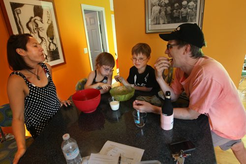 The Musical Latimer Family- L to R- Keri Latimer, Hazel,Oscar and her husband Devin enjoy some snacks together- The two are working on a solo musical project to be released soon-  See  Joe and Melissas 49.8 feature- July 02, 2014   (JOE BRYKSA / WINNIPEG FREE PRESS)