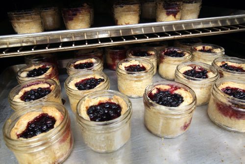 Baker Heather Daymond, not pictured, of Shut Ur PieHole! Makes pies that make people happy- These are her mini pies in a jar coming out of a oven in Knox United Church- See 49.8 feature- July 02, 2014   (JOE BRYKSA / WINNIPEG FREE PRESS)