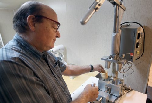 Baker Giuseppe (Joe) Palumbo has created La Tazzina  a edible coffee cup- He shows machine he designed to make the cups- See 49.8 feature- July 02, 2014   (JOE BRYKSA / WINNIPEG FREE PRESS)