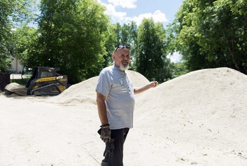 St. Francis resident Stephen Burdy has piles of dirt in his driveway he will use to build dikes on his property to prevent severe flooding. This year he has purchased 22 piles and went through 38 last year. Sarah Taylor / Winnipeg Free Press