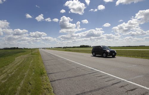 A car travelling northbound on the  I-29 highway between Grand Forks and the border.   Dan Lett story Wayne Glowacki / Winnipeg Free Press July 3  2014