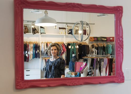 Designer and owner of EMK Clothing Erin Kembel stands in her store on Sherbrook Street. Sarah Taylor / Winnipeg Free Press July 4th, 2014