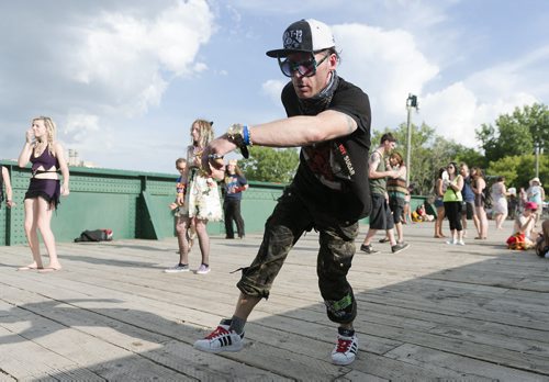 Dino Valentino dances at the Forks Bridge Party on Saturday. The electronic music festival was hosted by MEMETIC. Sarah Taylor / Winnipeg Free Press July 5th, 2014