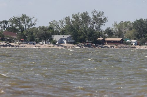 Water laps the shore along Twin Lakes Beach Sunday morning, a couple weeks from now the water conditions could be worse than the flood of 2011. 140706 - Sunday, July 06, 2014 -  (MIKE DEAL / WINNIPEG FREE PRESS)