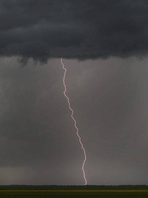 A lightning bolt hits the ground in Rosser, Manitoba as a large thunderstorm front makes its way towards the City of Winnipeg Monday - Standup Photo- July 07, 2014   (JOE BRYKSA / WINNIPEG FREE PRESS)