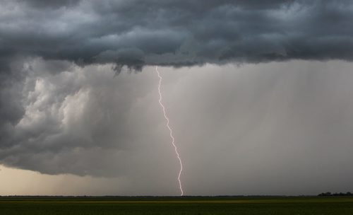 A lightning bolt hits the ground in Rosser, Manitoba as a large thunderstorm front makes its way towards the City of Winnipeg Monday - Standup Photo- July 07, 2014   (JOE BRYKSA / WINNIPEG FREE PRESS)