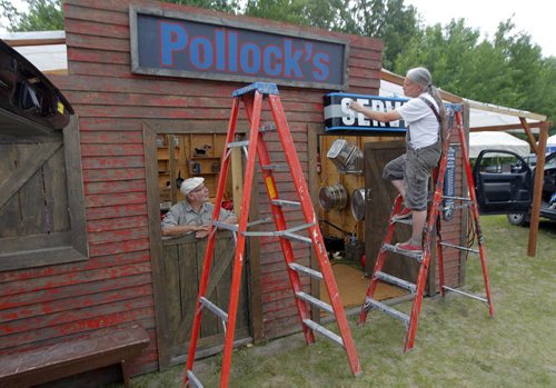 LOCAL/ENTERTAINMENT - John and Mike Wolchock set up the Pollock Harware booth fix it shop in the campground. The popular music festival starts tomorrow. BORIS MINKEVICH / WINNIPEG FREE PRESS  July 8, 2014