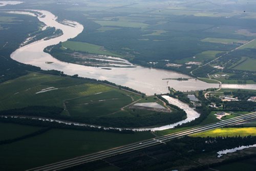 Heavy rains in western Manitoba and Saskatchewan recently have raised the level of the Assiniboine River causing it to overflow its banks flooding roads and farmers fields.   Aerial photo's of  Portage diversion dam just west of town where water is diverted north to Lake Manitoba.    July 08, 2014 Ruth Bonneville / Winnipeg Free Press