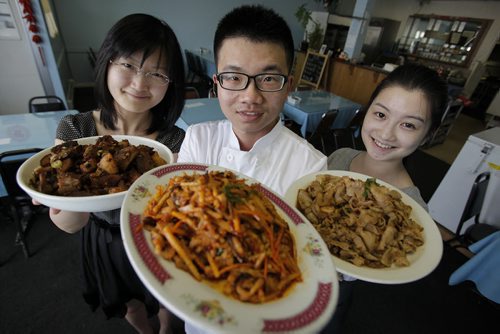 July 8, 2014 - 140708  -  (L to R) Jing Feng wife of Leilei Du, owner/chef and waitress Ailang Hou of the Winnipeg Flying Noodle House Monday, July 8, 2014. John Woods / Winnipeg Free Press