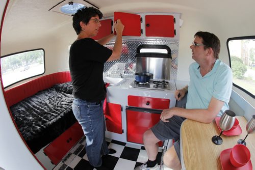 July 8, 2014 - 140708  -  On Monday, July 8, 2014 Kelly Klick and her husband Tom McMahon are photographed in their restored 1975 Boler camper. The 1975 Boler camper is owned by  Kelly Klick and Tom McMahon and was restored by Kelly and her father Jack. John Woods / Winnipeg Free Press