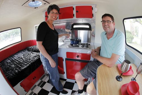 July 8, 2014 - 140708  -  On Monday, July 8, 2014 Kelly Klick and her husband Tom McMahon are photographed in their restored 1975 Boler camper. The 1975 Boler camper is owned by  Kelly Klick and Tom McMahon and was restored by Kelly and her father Jack. John Woods / Winnipeg Free Press